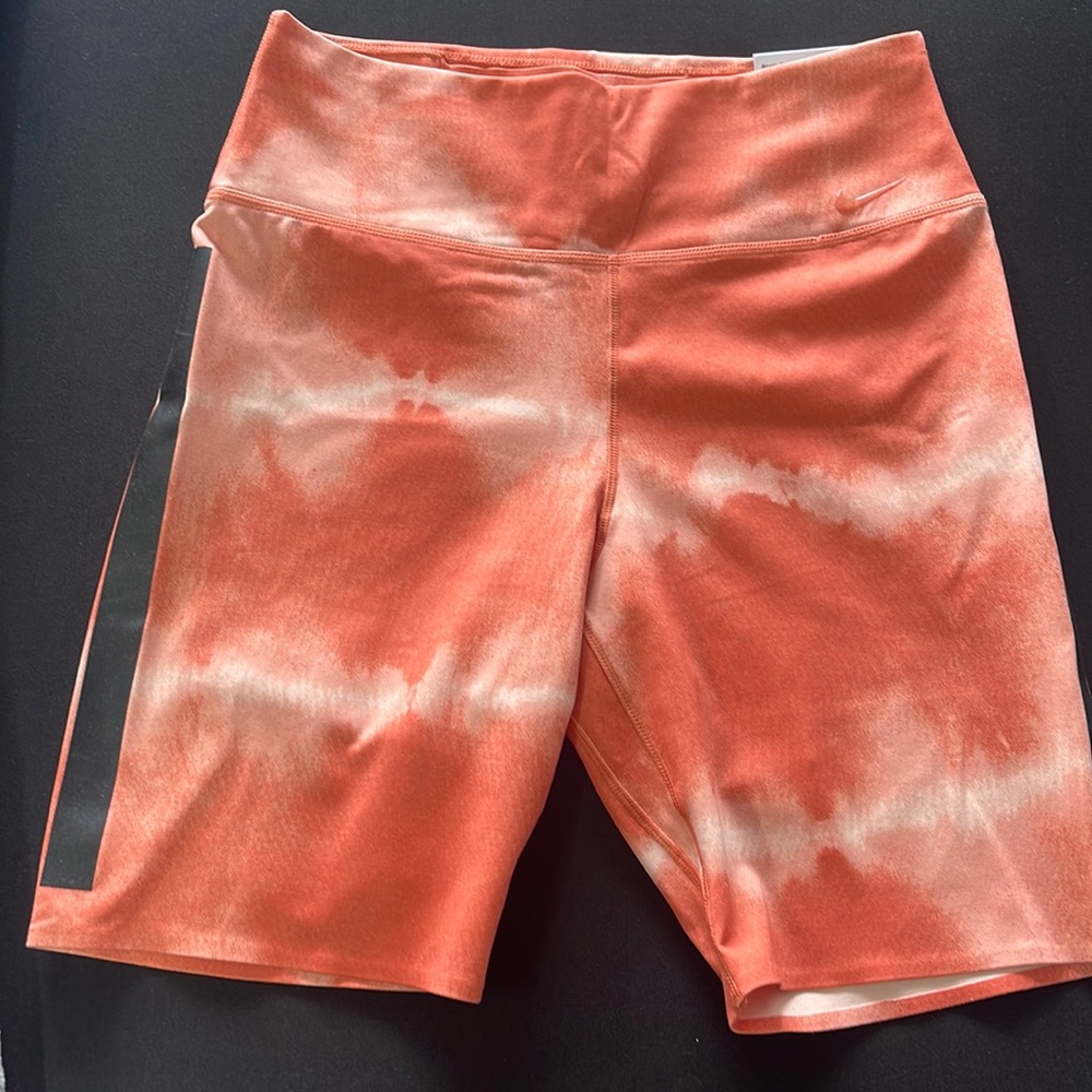 Nike One Luxe tight fit mid rise 7” length shorts. Size Small